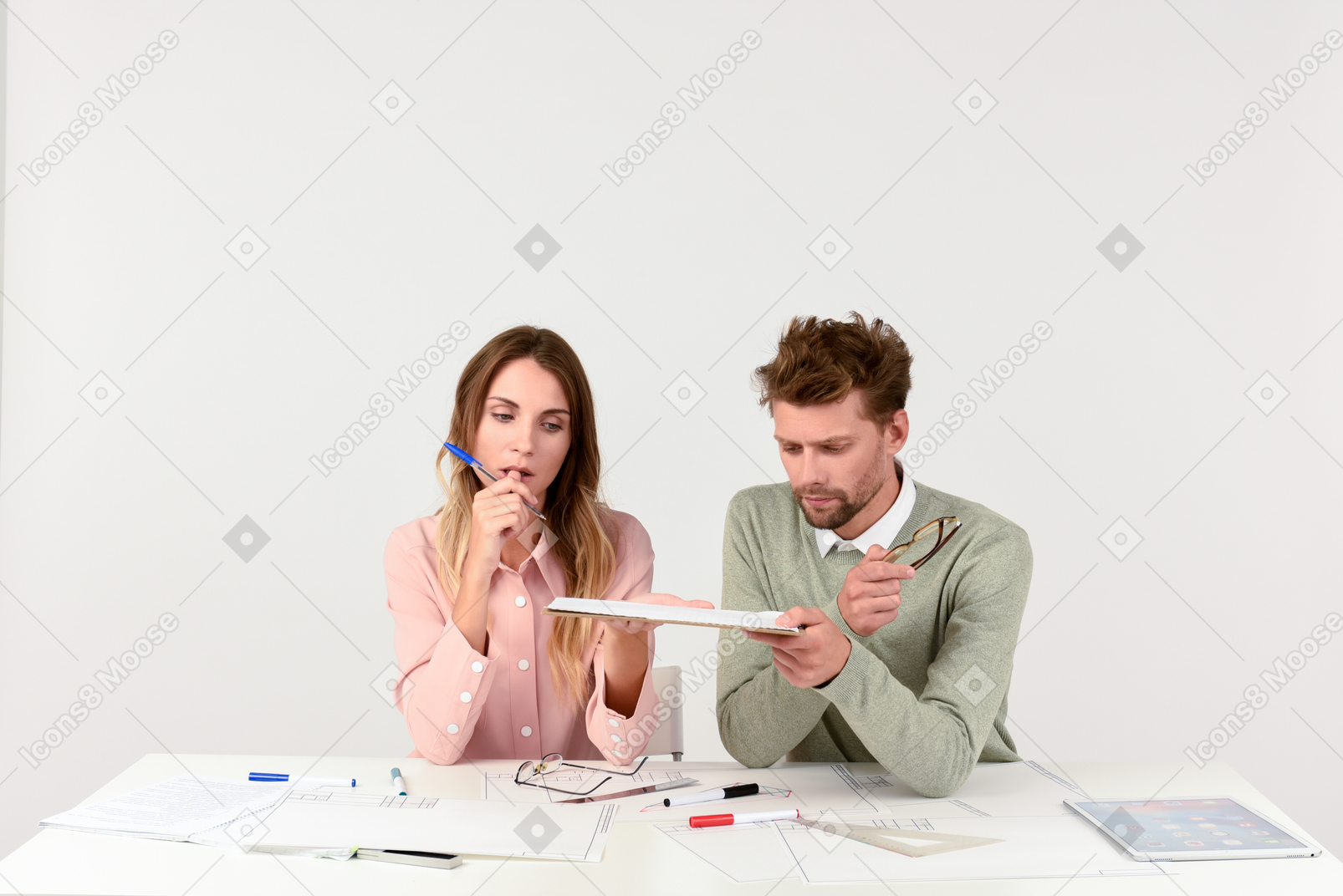 Architects sitting at the tablet and holding tablet