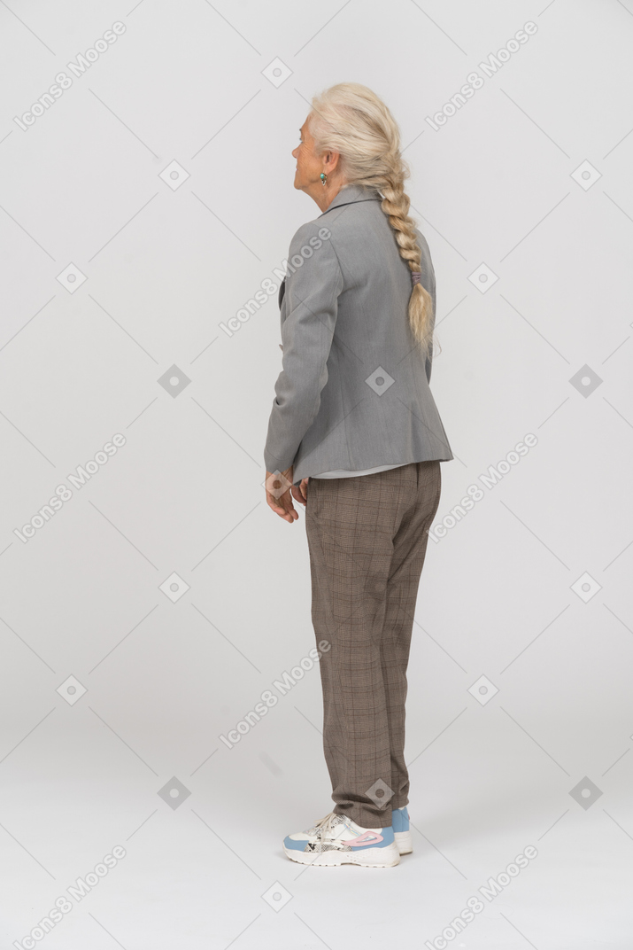 Side view of an old lady in suit