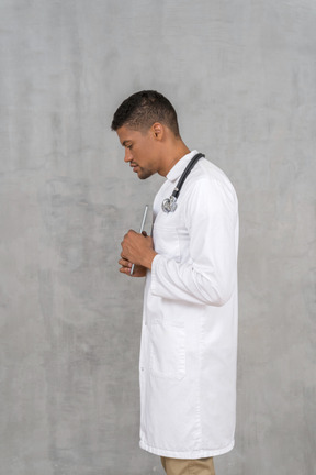 Side view of a solemn-looking doctor