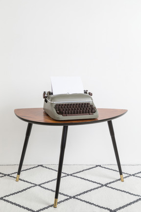 Vintage typewriter on vintage coffee table