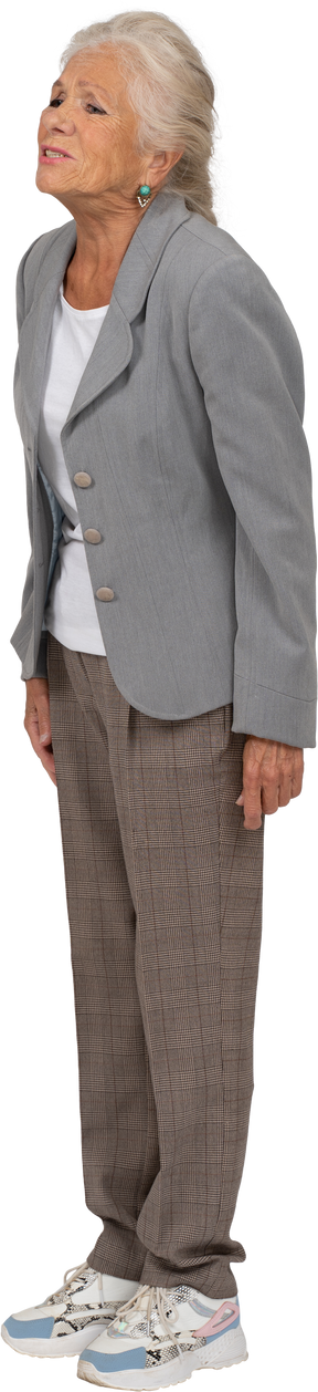 Side view of an upset old lady in suit