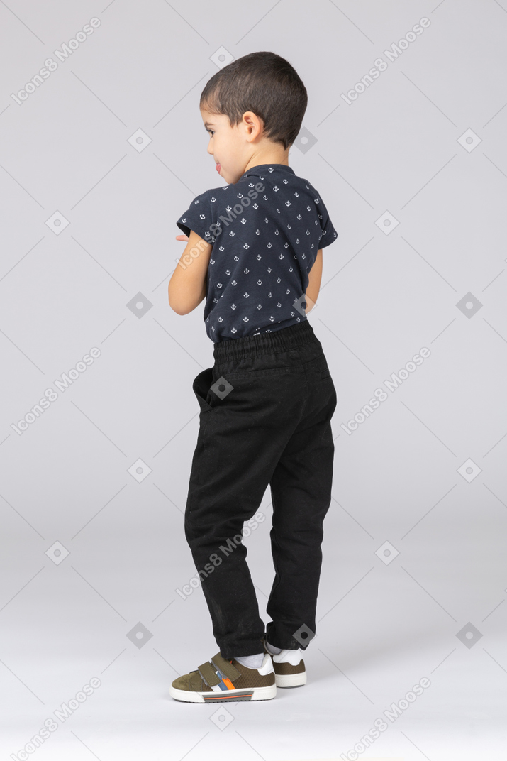 Side view of a cute boy in casual clothes