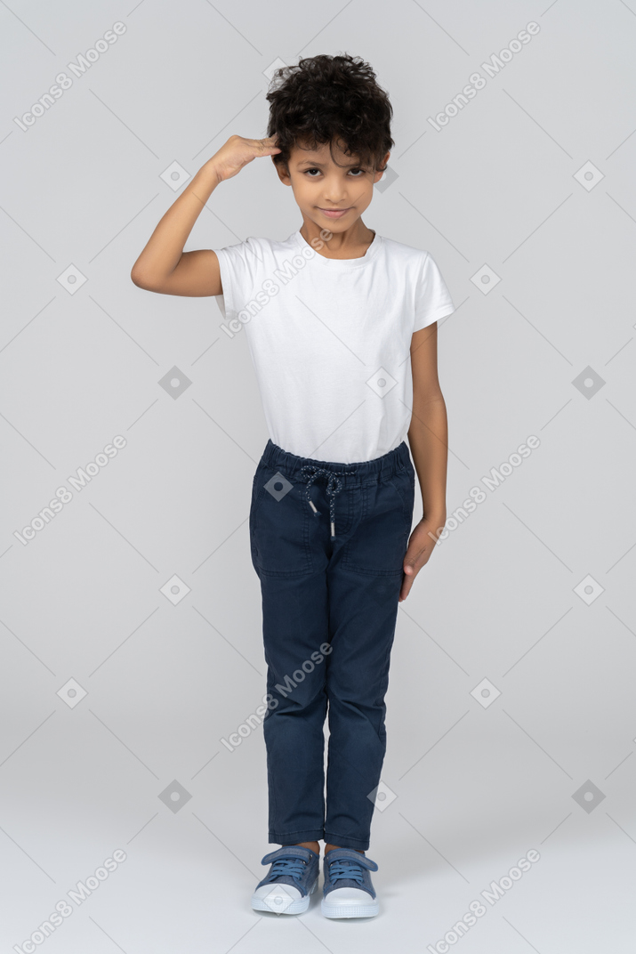 A saluting boy
