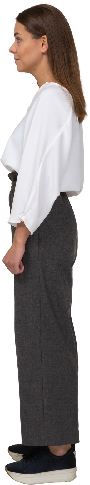 Side view of a young lady in office clothing looking aside