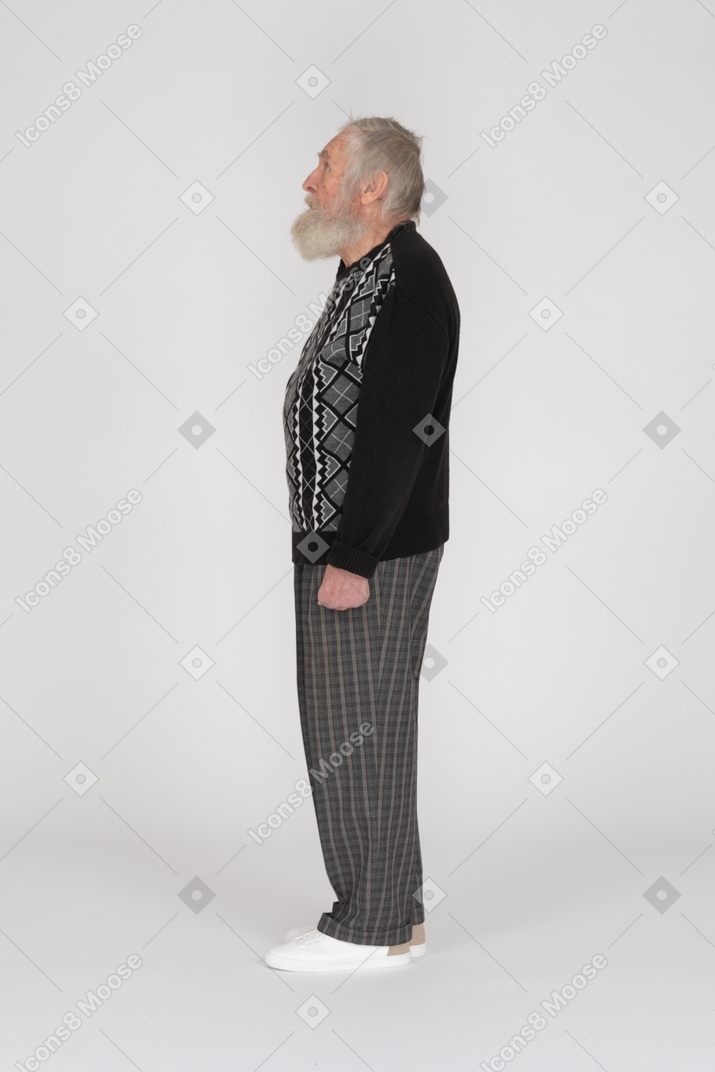 Side view of old man standing straight