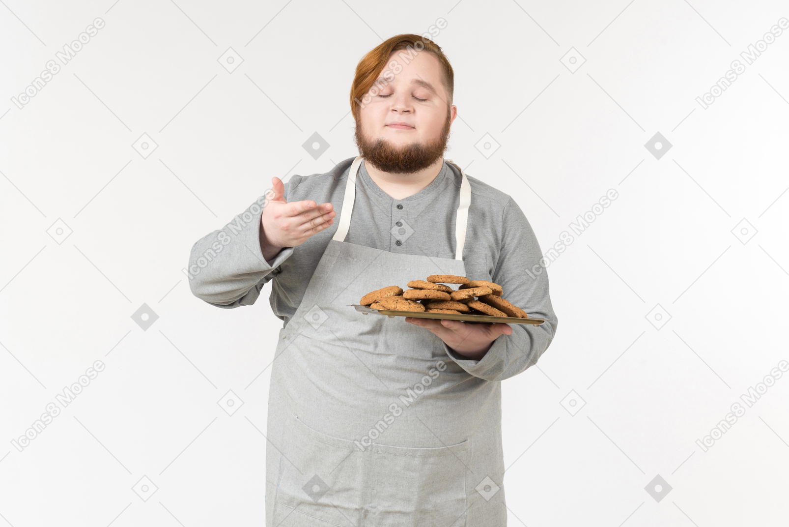 A fat man smelling freshly baked cookies