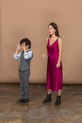 Young girl and a boy standing together