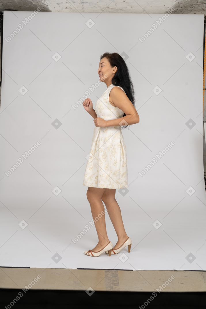 Woman in a white dress standing