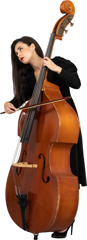 Three-quarter view of a young woman in black dress playing the double-bass with a bow