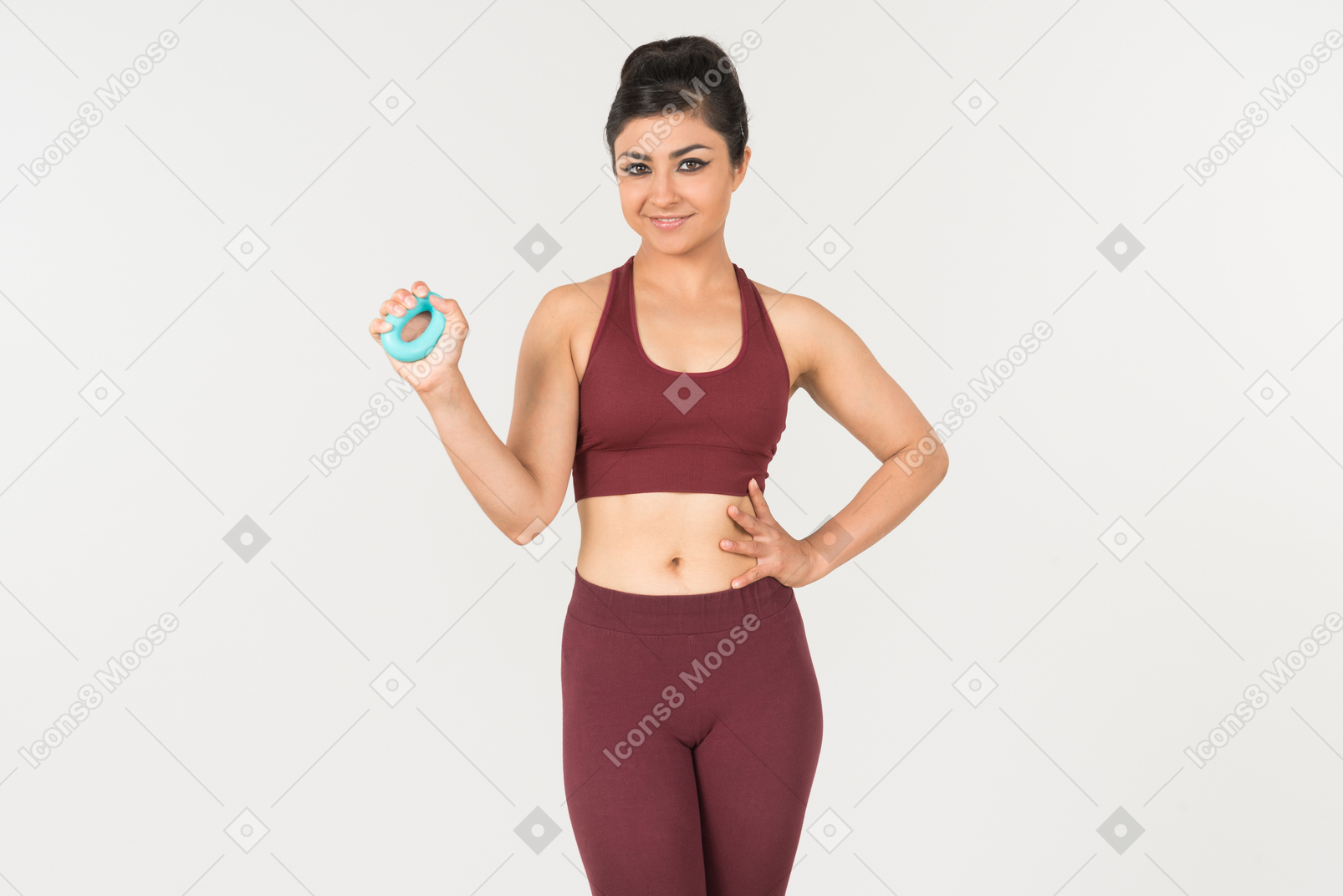 Young indian woman in sporstwear holding cloth ruler folded in her wrist