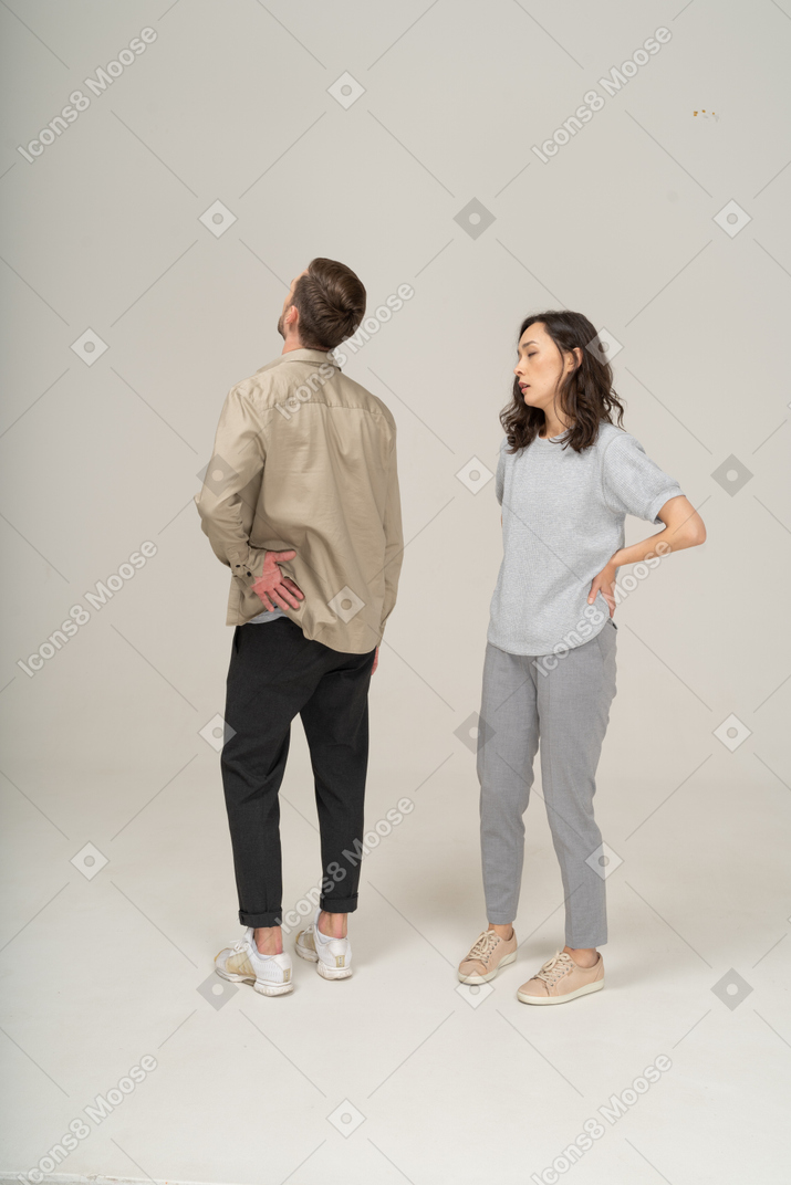 Exhausted young man and woman standing