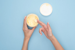 Applying moisturizer cream
