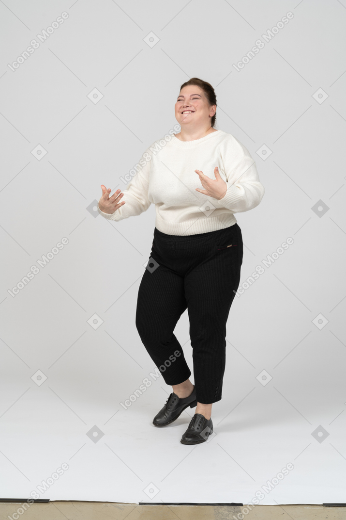 Cheerful plump woman in white sweater