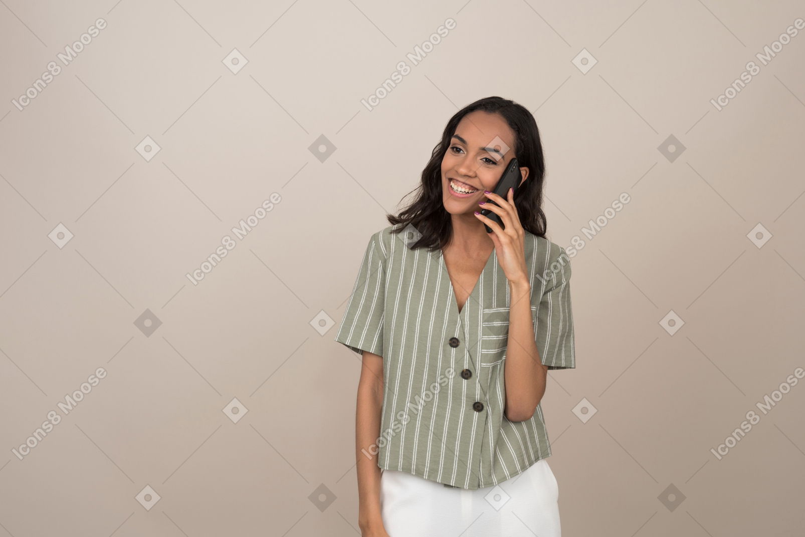 Young pretty girl talking on the phone and smiling