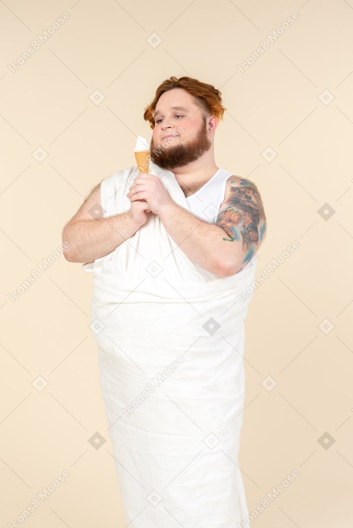 Young big man holding ice cream