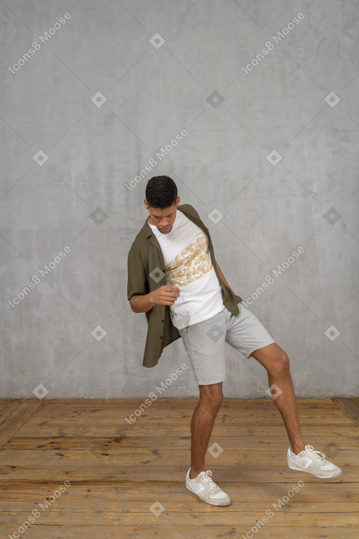 Man leaning sideways with his foot raised