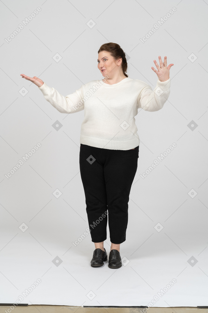 Front view of a plump woman in casual clothes posing