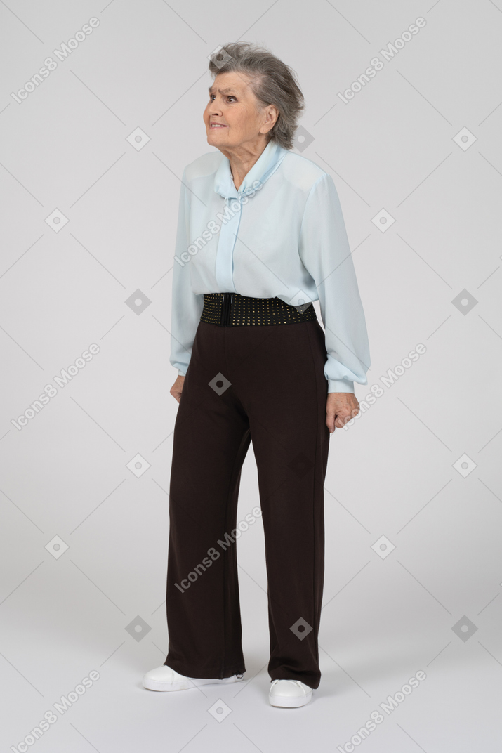 Three-quarter view of an old woman radiating passive aggressive energy