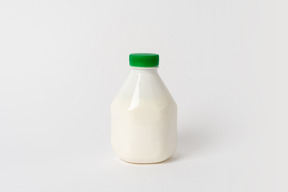 Small plastic bottle with some dairy product inside