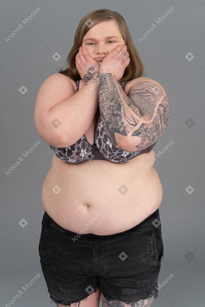 Plump woman holding her cheeks