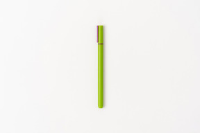 Green pencil on white background