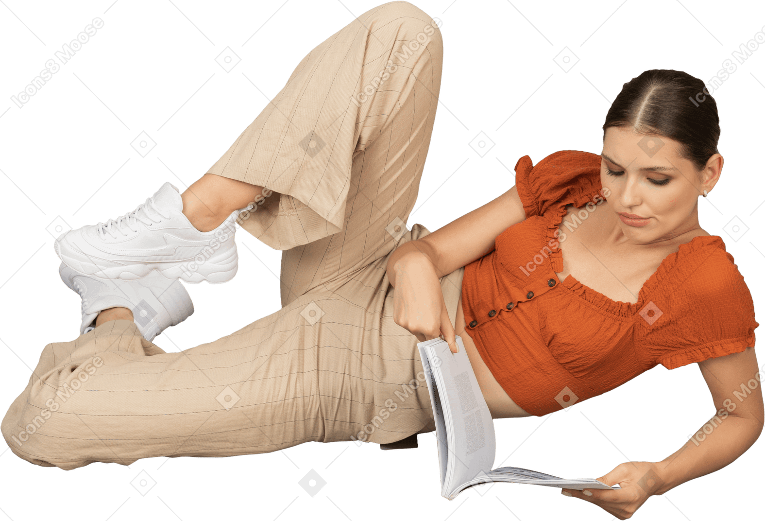 Young woman lying down with book