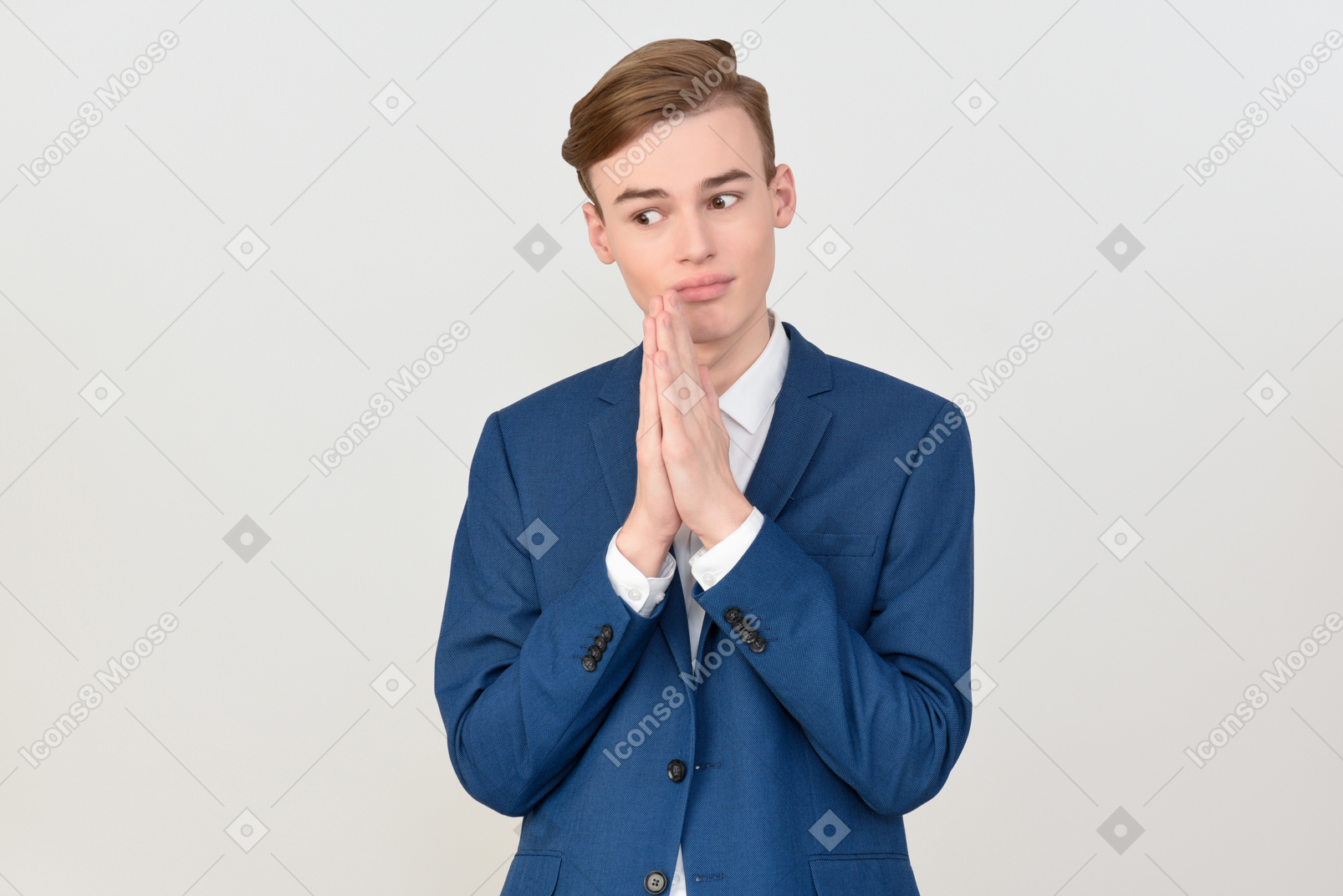Handsome young man in suit with folded hands looks like begging