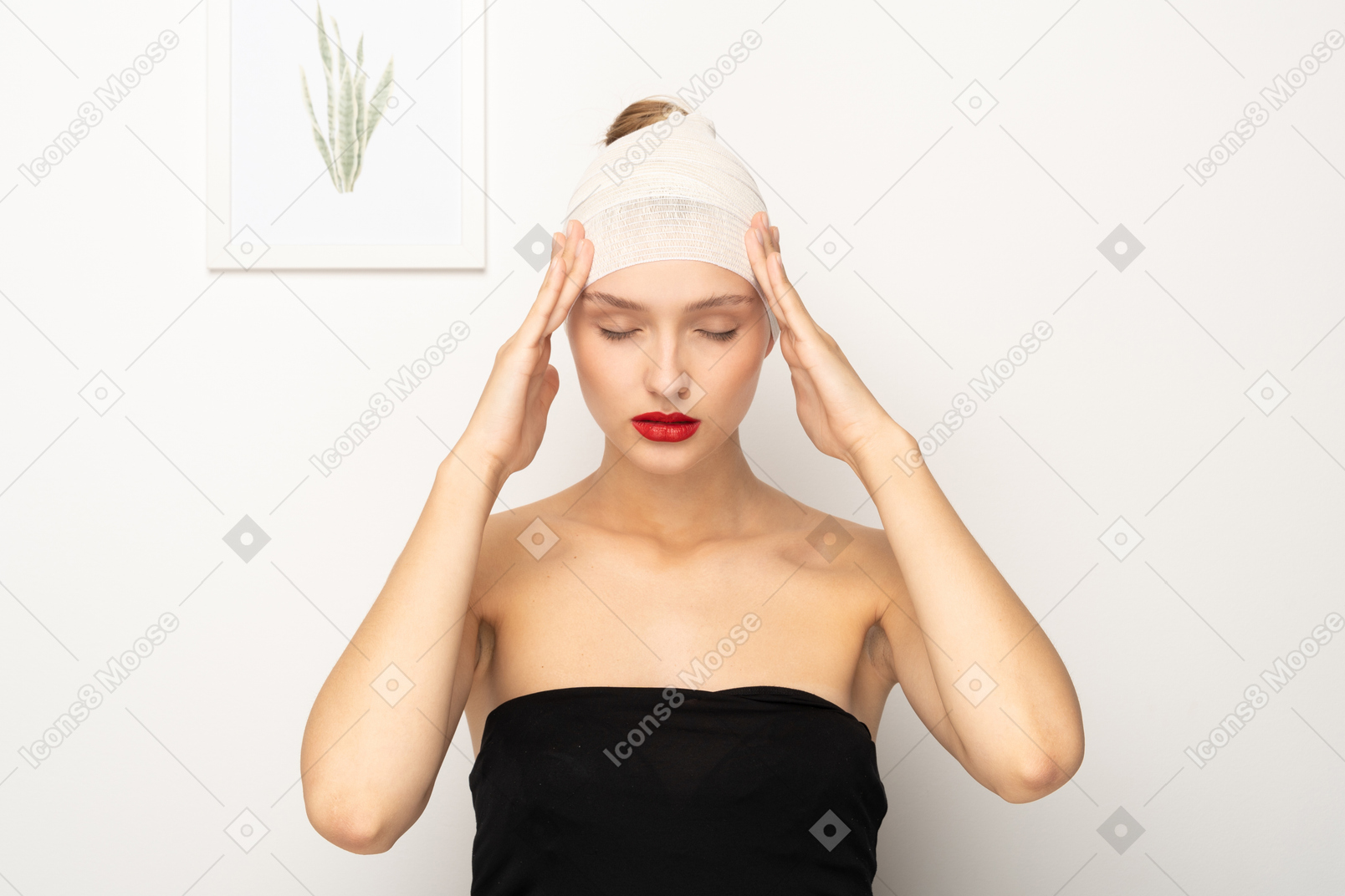 Young woman holding her head with both hands