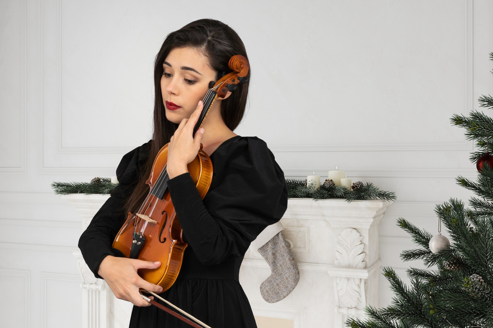 Young woman got a violin as a christmas gift