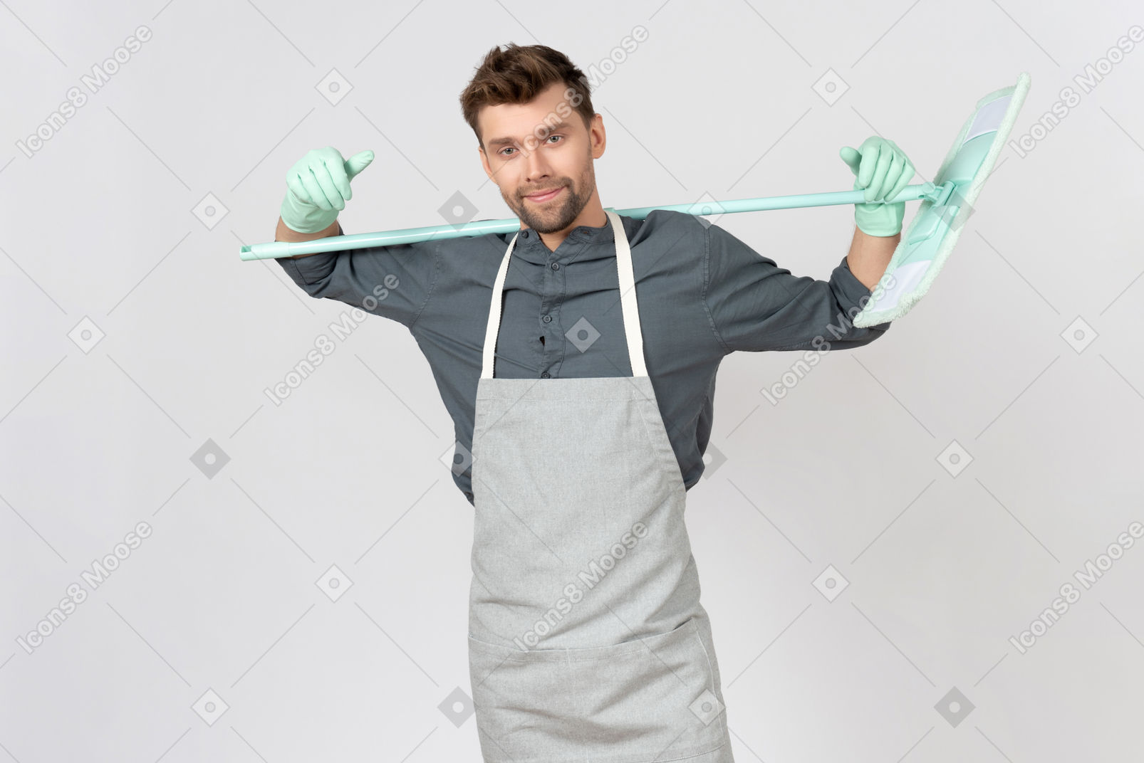 Young househusband holding mop on his back