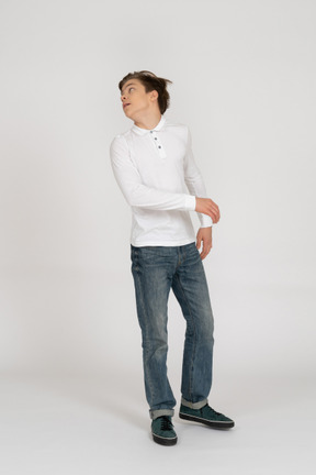 Young man in casual clothes standing