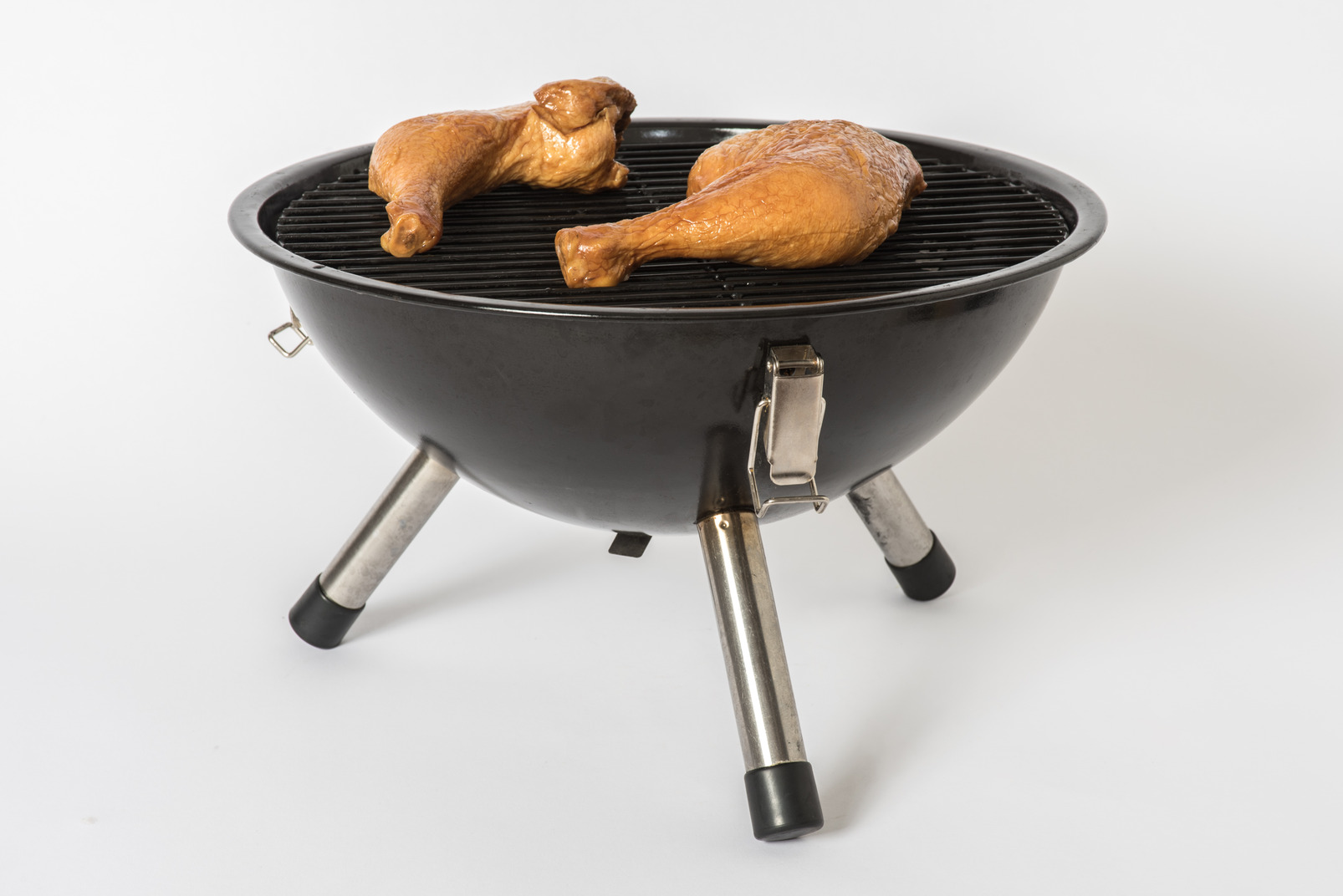 Fried chicken legs on grill
