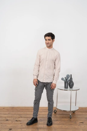 Front view of a man in casual clothes looking at camera
