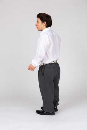 Side view of a cheerful office worker looking away