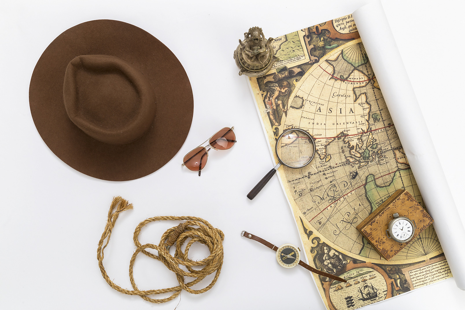 Tweed hat, map, sunglasses, rope, magnifying glass and compass