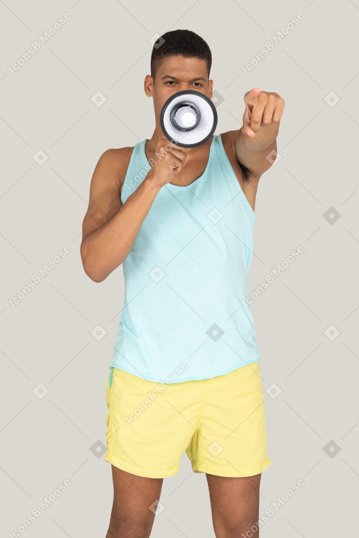 Man holding a megaphone and pointing at camera
