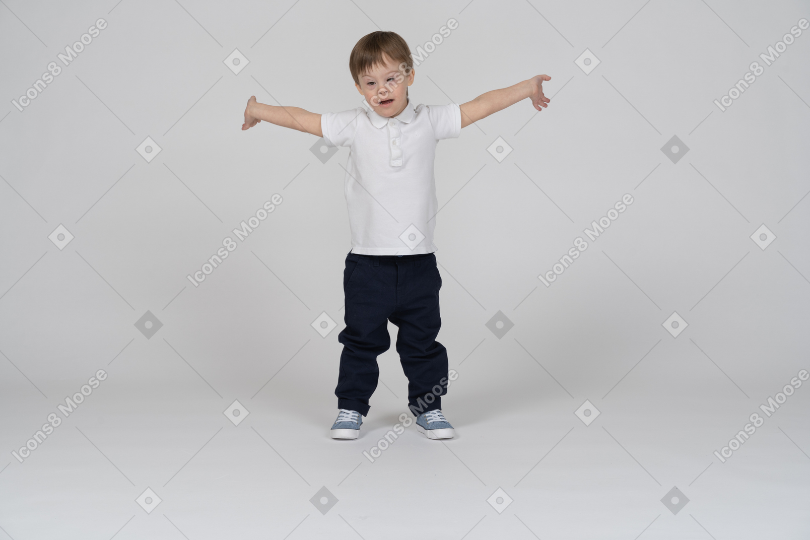 Little boy standing with his arms extended