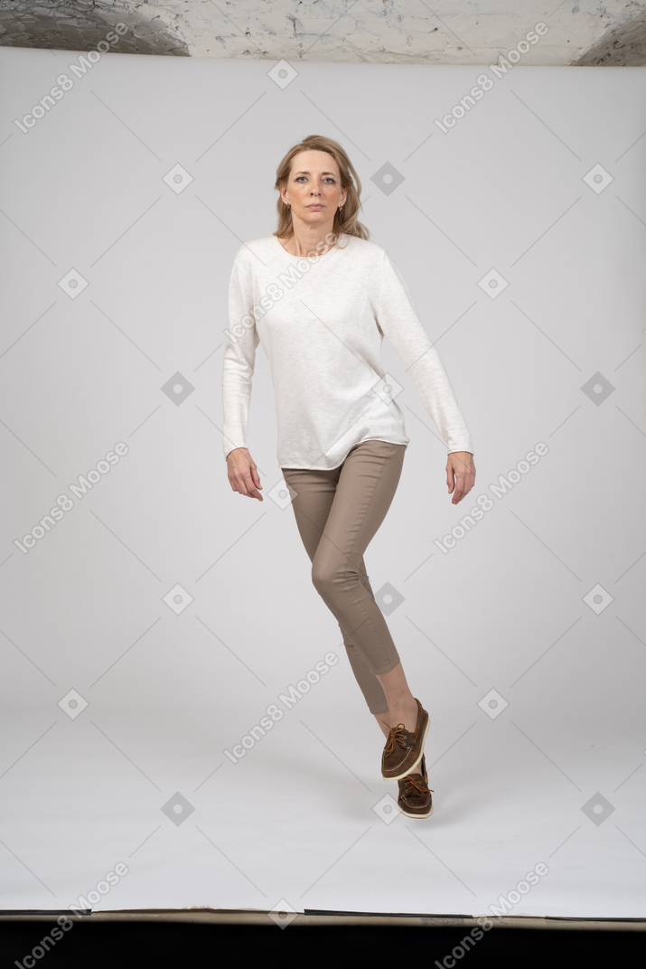 Woman in casual clothes jumping
