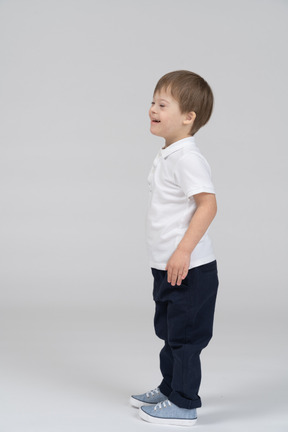 Side view of laughing little boy