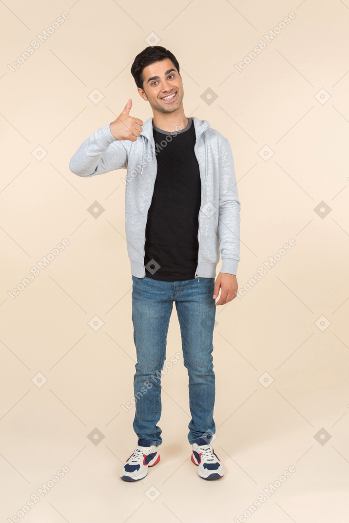 Smiling caucasian man showing thumbs up