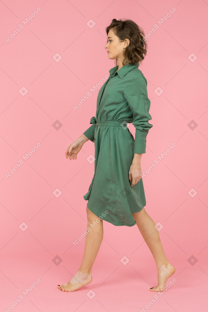 Barefooted woman walking sideways