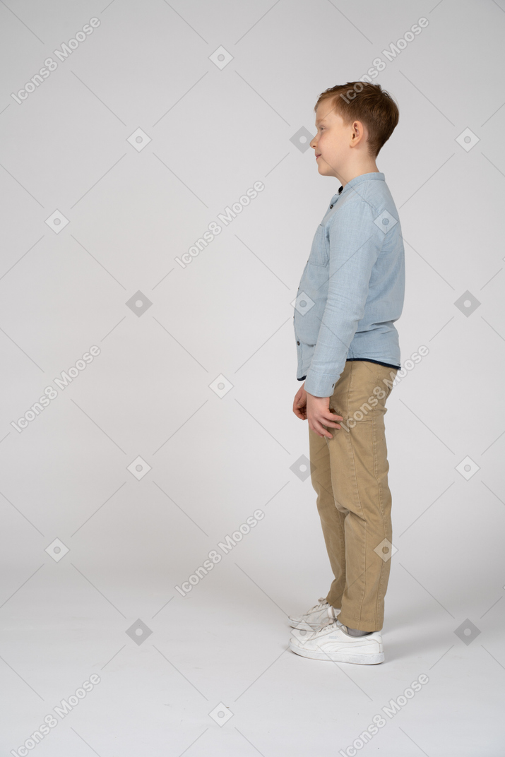 Lovely boy standing in profile