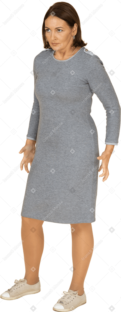 Front view of an angry woman in grey dress
