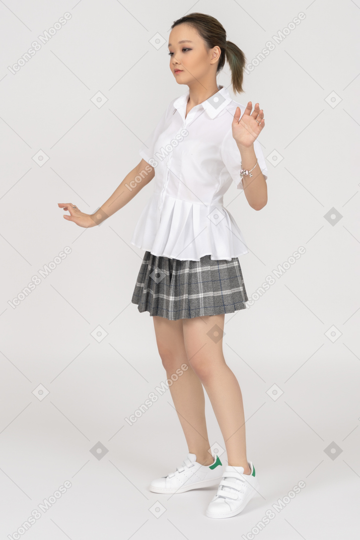 An asian girl moving her hands