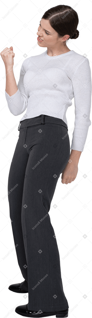 Side view of a delighted young woman in office clothing