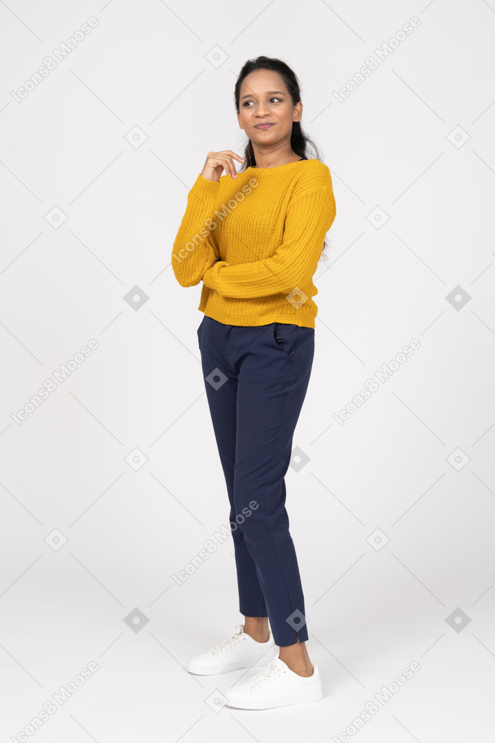 Front view of a thoughtful cute girl in casual clothes