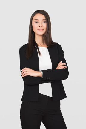 Business woman standing with folded arms