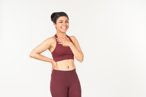 Indian girl in sporstwear checking fitness tracker