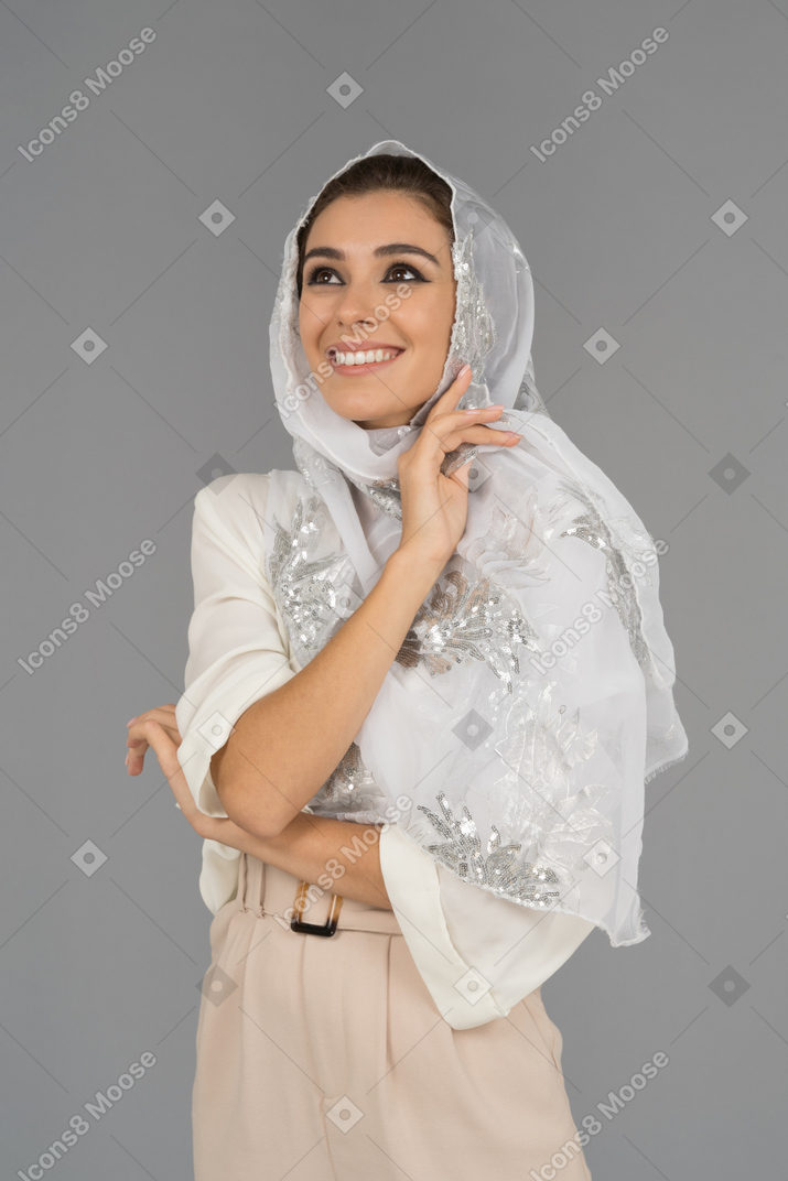Beautiful smiling young woman wearing white headscarf