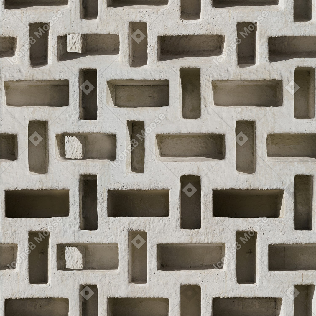 Parede de concreto com orifícios geométricos